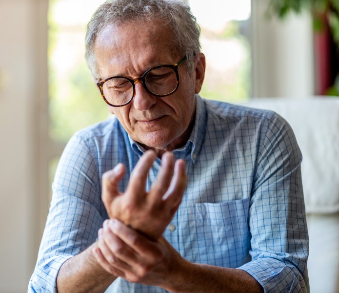 Man Holding Knee